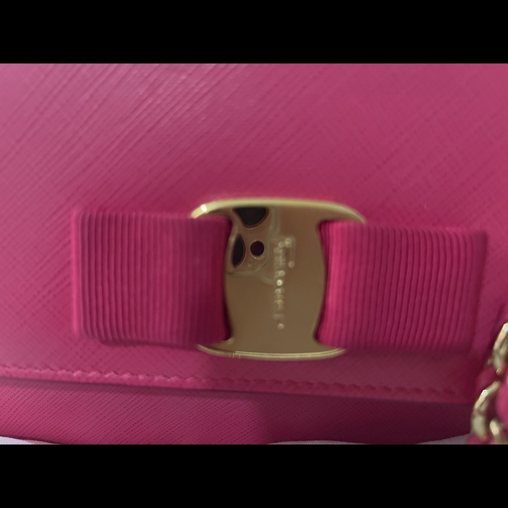 Ferragamo Vera bow crossbody with gold chain bag.